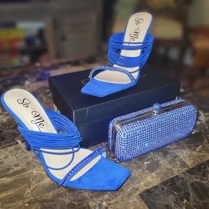 Royal blue jeweled heels with matching bag
